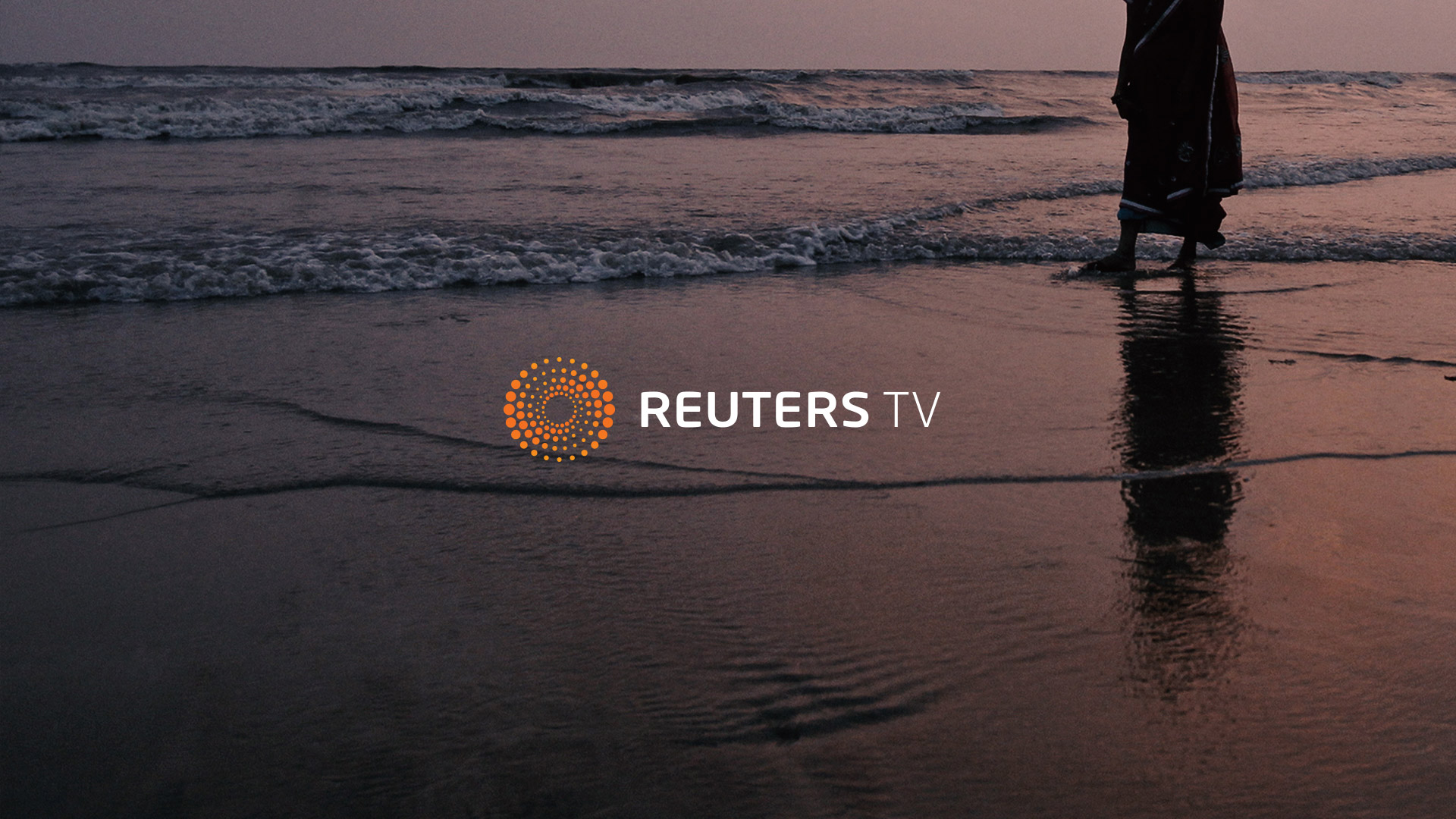 Reuters TV logo card Reuters TV logo card over a shoreline at dusk