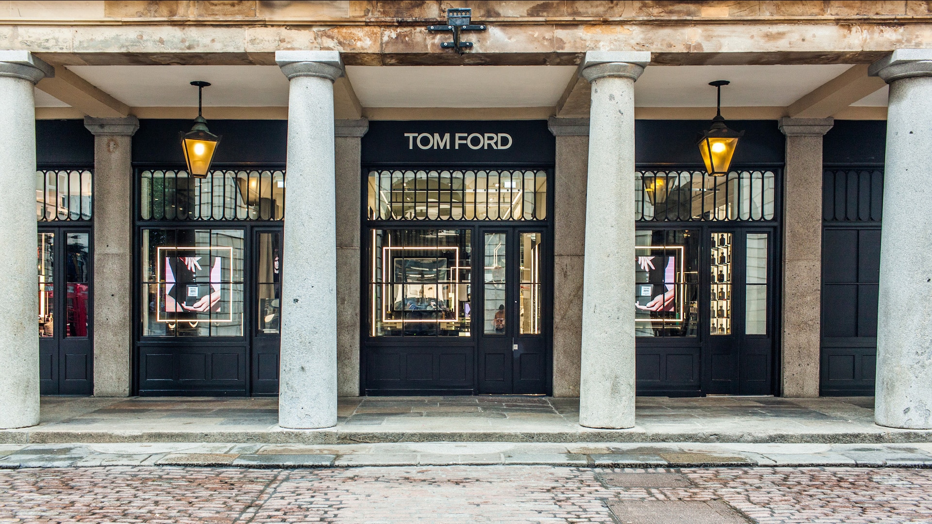 Tom Ford storefront under a stone colonnade